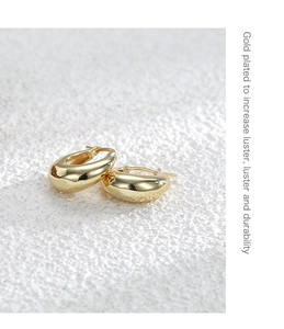 Macro shot of gold plated hoop earring showing high luster and durable metal texture