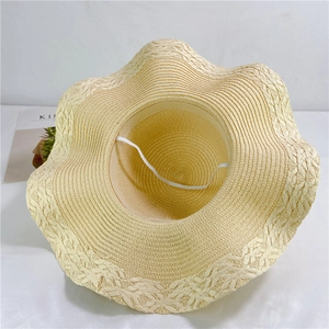 Beige straw sun hat with wavy brim and elastic windproof strap for women's beachwear