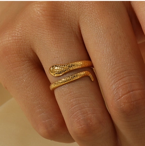 Macro shot of 18K gold plated snake ring showing detailed scales and textured surface