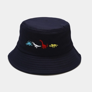 Close-up of colorful dinosaur embroidery on a navy cotton twill bucket hat for kids