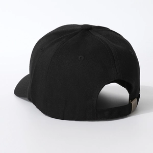 Detail view of the black cotton baseball cap showing adjustable bronze metal buckle