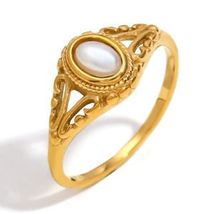 Gold plated stainless steel ring with white oval pearl and floral engraved patterns