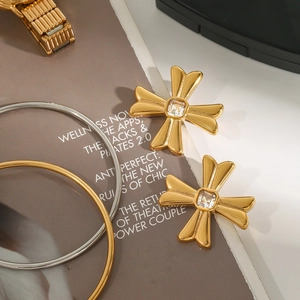 Luxurious gold cross stud earrings with sparkling zircon crystals and elegant bracelets