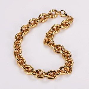 Detail shot of a glossy gold chunky chain necklace with a sturdy lobster clasp and O-rings