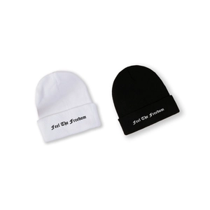 Winter knitted beanie hats in black and white with Feel The Freedom embroidery