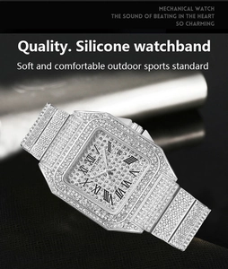 Macro detail of iced out square watch with silver crystals and black Roman numerals