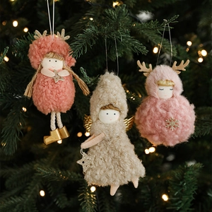 Plush Christmas tree dolls set with elk antlers and angel wings in festive lighting