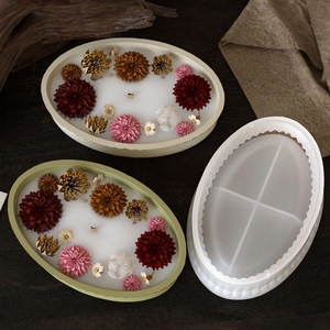 Detailed top view of a translucent oval resin mold with dried flower candle crafts