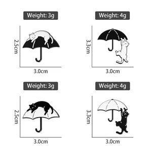 Cartoon cat and umbrella enamel pins set with size and weight specifications
