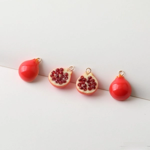 Miniature resin pomegranate charms with glossy seeds and gold loops for DIY jewelry