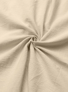 Detailed macro texture of beige linen fabric showing high-quality natural fiber weave