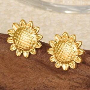 Macro detail of sunflower studs in 18k gold-plated 304 stainless steel on wood