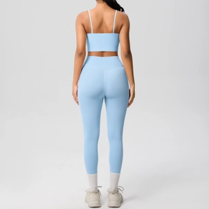Light blue yoga set with strappy crop top and high waist leggings for fitness and sports