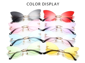 Detailed color display of butterfly-shaped rimless sunglasses in eight vibrant gradient tints