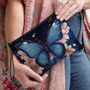 Navy blue butterfly and floral print makeup bag with zipper and wristlet strap