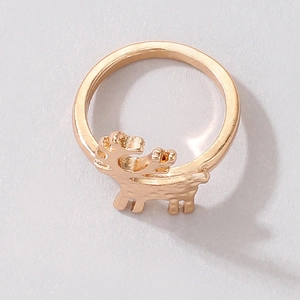 Detail shot of golden reindeer ring with hammered texture and metallic finish