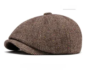 Detailed texture of brown herringbone tweed newsboy cap with subtle colorful fiber flecks