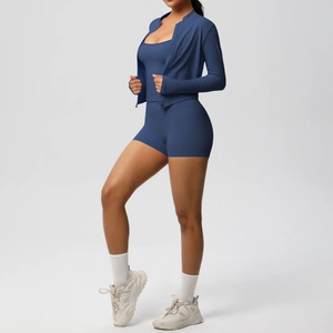 Three-piece dark blue yoga set featuring a zip jacket, sports bra, and high-waist shorts
