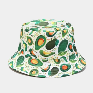 Detailed close-up of canvas bucket hat featuring vibrant all-over avocado fruit pattern