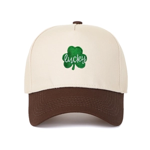 Detail of leaf embroidery and lucky text on a color-block 5-panel trucker hat