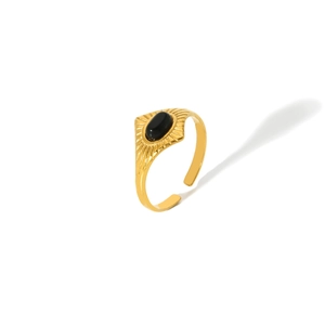 Detail of 18k gold vintage stainless steel open ring with oval black natural stone