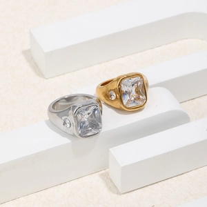18K gold and silver stainless steel rings with square cubic zirconia on white blocks