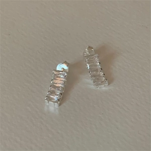 Close-up of S925 sterling silver bar earrings with rectangular zircon stones
