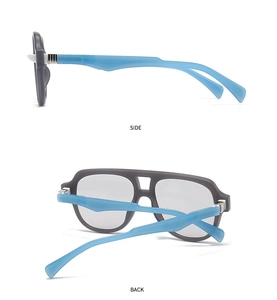 Detail view showing the grey frame with blue temples and sturdy metal hinges of the glasses