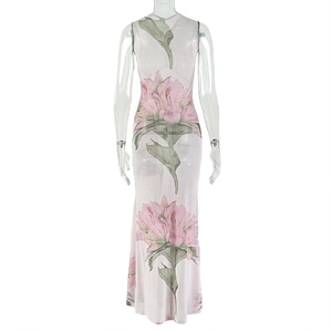 Close-up of elegant pink peony floral print on sheer sleeveless long dress fabric