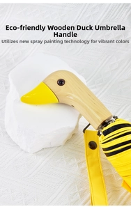 Detail of creative duck head wooden handle with yellow and black striped fabric