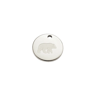 Polished stainless steel round pendant featuring an engraved walking bear pattern design