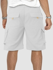 Rear view of white cargo shorts featuring elastic waist and multiple functional pockets