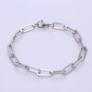 Minimalist 7mm silver stainless steel paper clip chain bracelet on a lavender backdrop