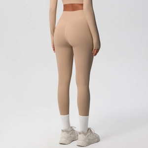Rear view of light brown high waist yoga set with body shaping fit and seamless fabric