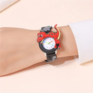 Close-up of kids' 3D red dinosaur watch on wrist with embossed black rubber strap
