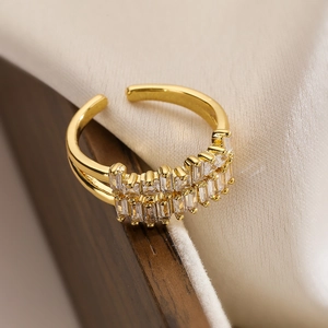 Macro detail of gold-plated double-layer ring featuring two rows of baguette zirconia