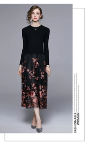 Close-up of vintage floral embroidery details on the black tulle skirt hem and knit fabric