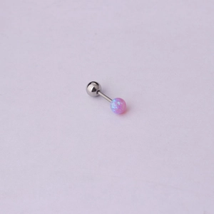 Close-up of pink opal cartilage earring stud with silver stainless steel barbell screw