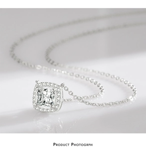 Close-up of S925 sterling silver necklace featuring a square zircon pendant with halo detail