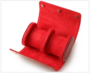 Detail of red leather watch roll with soft suede lining and removable watch cushions