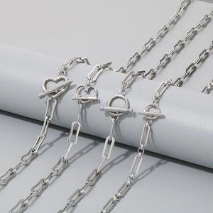 Minimalist silver stainless steel necklaces featuring OT toggle clasp and varied pendants