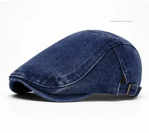 Detailed view of dark blue washed denim ivy cap with bronze adjustable side buckle