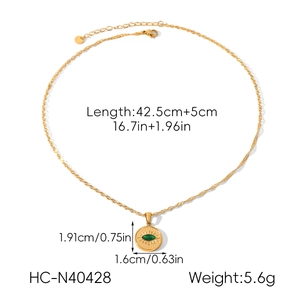 Detail view of gold titanium necklace with green zircon pendant including size dimensions