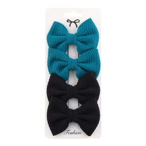 Detailed set of 4 polyester bow hair clips in dark teal and black on display card