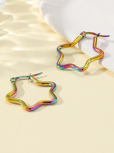 Macro detail of rainbow star titanium steel hoop earrings with polished surface