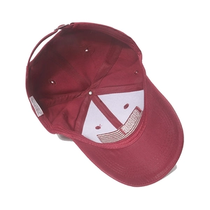 Detail view of cotton baseball cap interior with sweatband and metal buckle adjustment