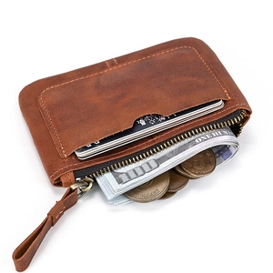 Detailed view of brown crazy horse leather wallet with zipper pocket and card slots