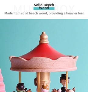 Detail of red carousel music box top made of solid beech wood with gold finial