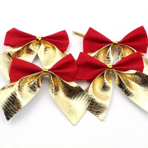 Close-up of red velvet and gold metallic Christmas bows for tree decoration in a pack of four