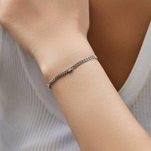 S925 sterling silver cuban chain bracelet featuring a D color moissanite stone on wrist